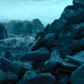 All Quiet on the Western Front (2022) – the boots of dead soldiers are tossed into a foreground&nbsp;pile
