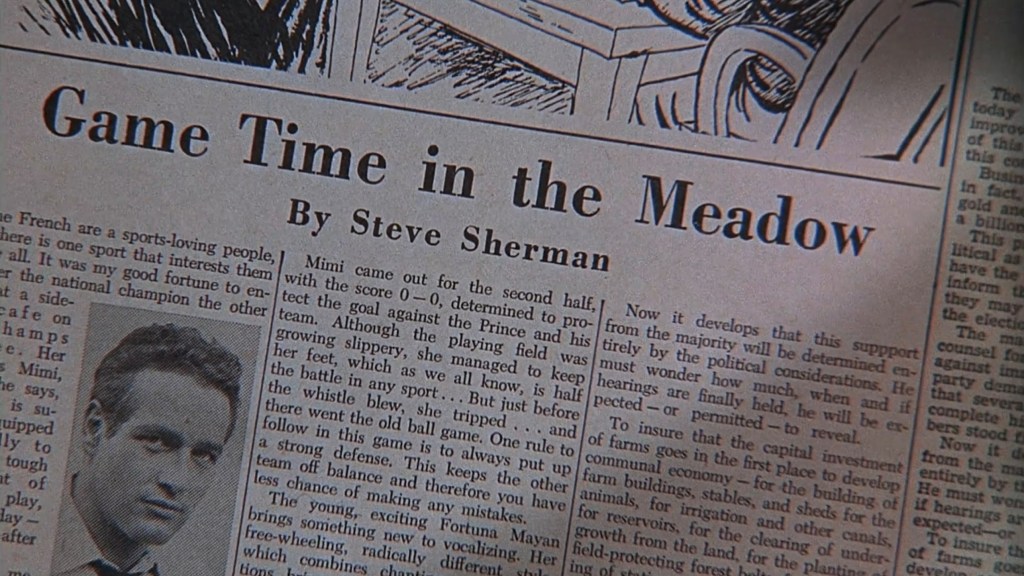 A close-up of a newspaper article titled 'Game Time in the Meadow' by Steve Sherman, featuring text and a portrait of a man.