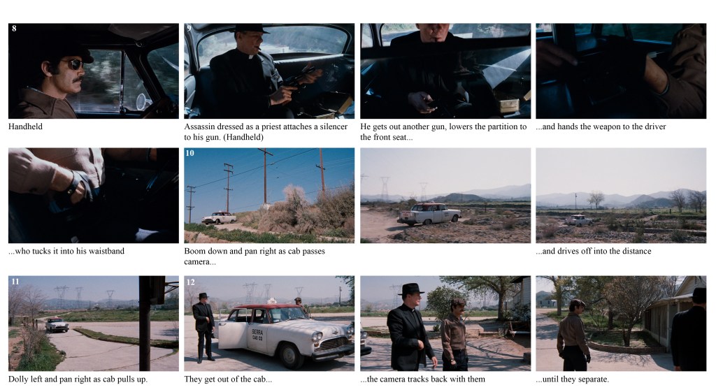 A close-up of a man with a mustache driving a car, showing a tense expression.