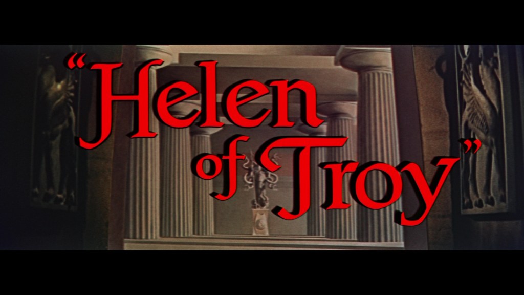Title card for the film 'Helen of Troy' featuring bold red letters against a backdrop of ancient pillars and decorative motifs.