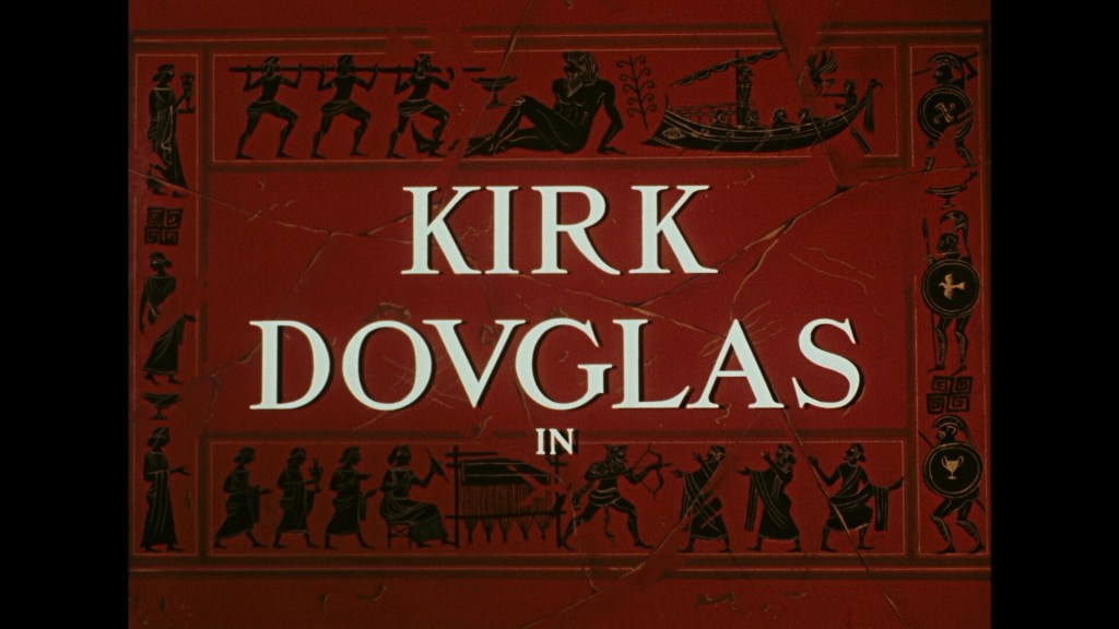 Title card featuring the name 'Kirk Douglas' with an ancient Greek motif background.