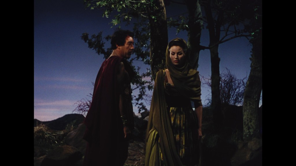 A scene depicting two figures in ancient attire, standing amidst trees and a twilight sky, with one figure looking back at the other, who appears contemplative.
