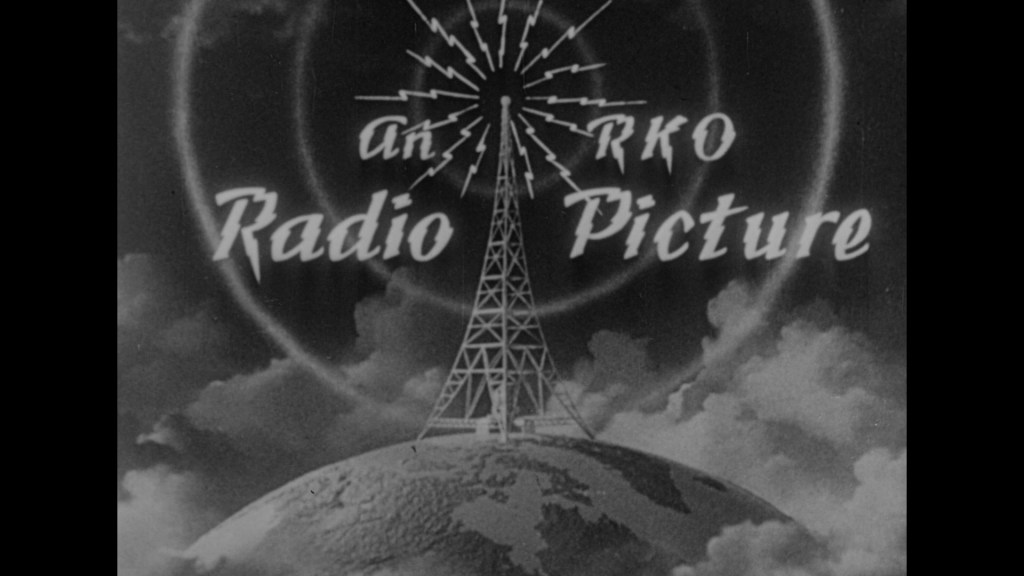 Vintage logo of RKO Radio Pictures featuring a radio tower emitting signals above a globe, set against a clouded background.