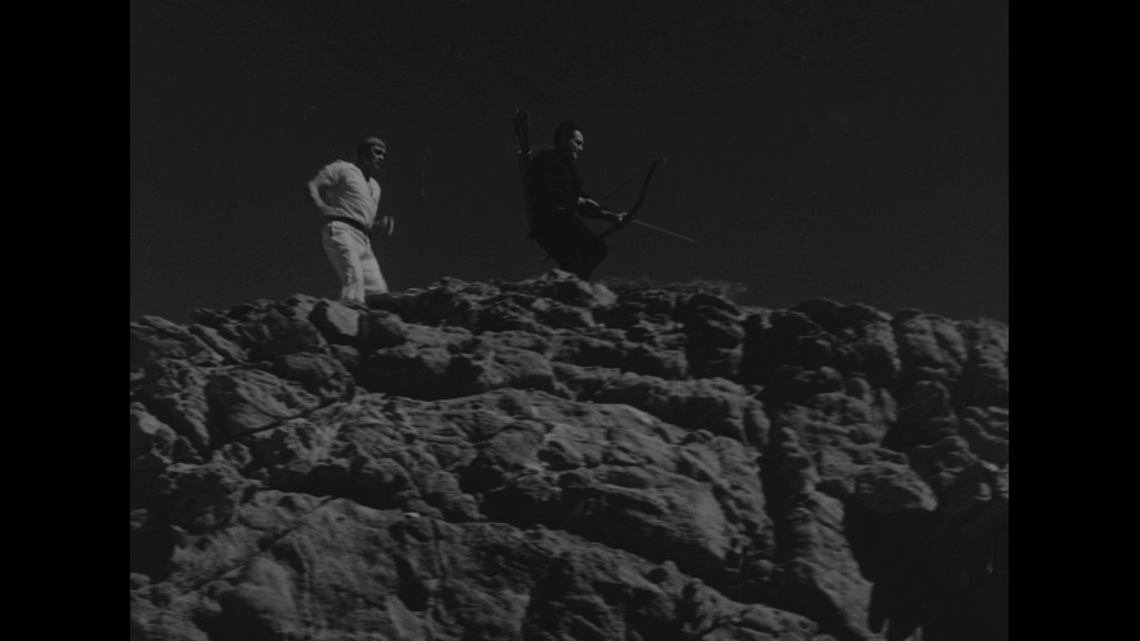 Two figures on a rocky landscape; one in a white outfit and the other in black, holding a bow.